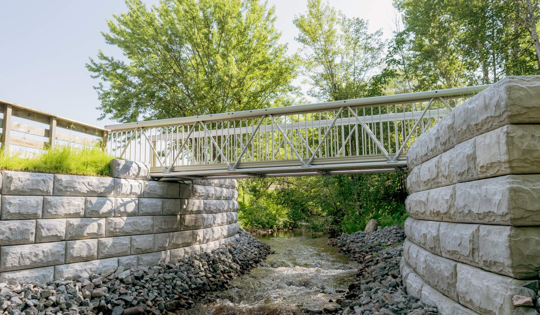 Weld-free bridge with clear anodized finish over creek in Canada