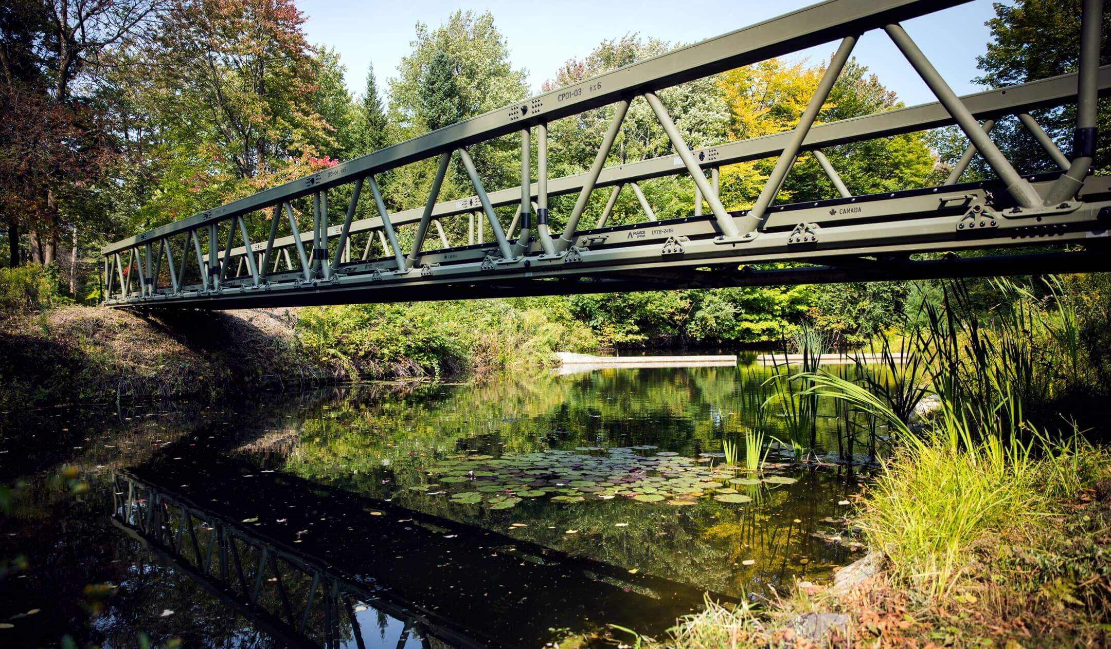 LVTB-2418 modular aluminum bridge with army green powder coating finish over water